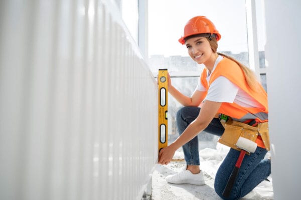 Dexel Structural Engineers Balcony Inspection service a lady inspecting a balcony